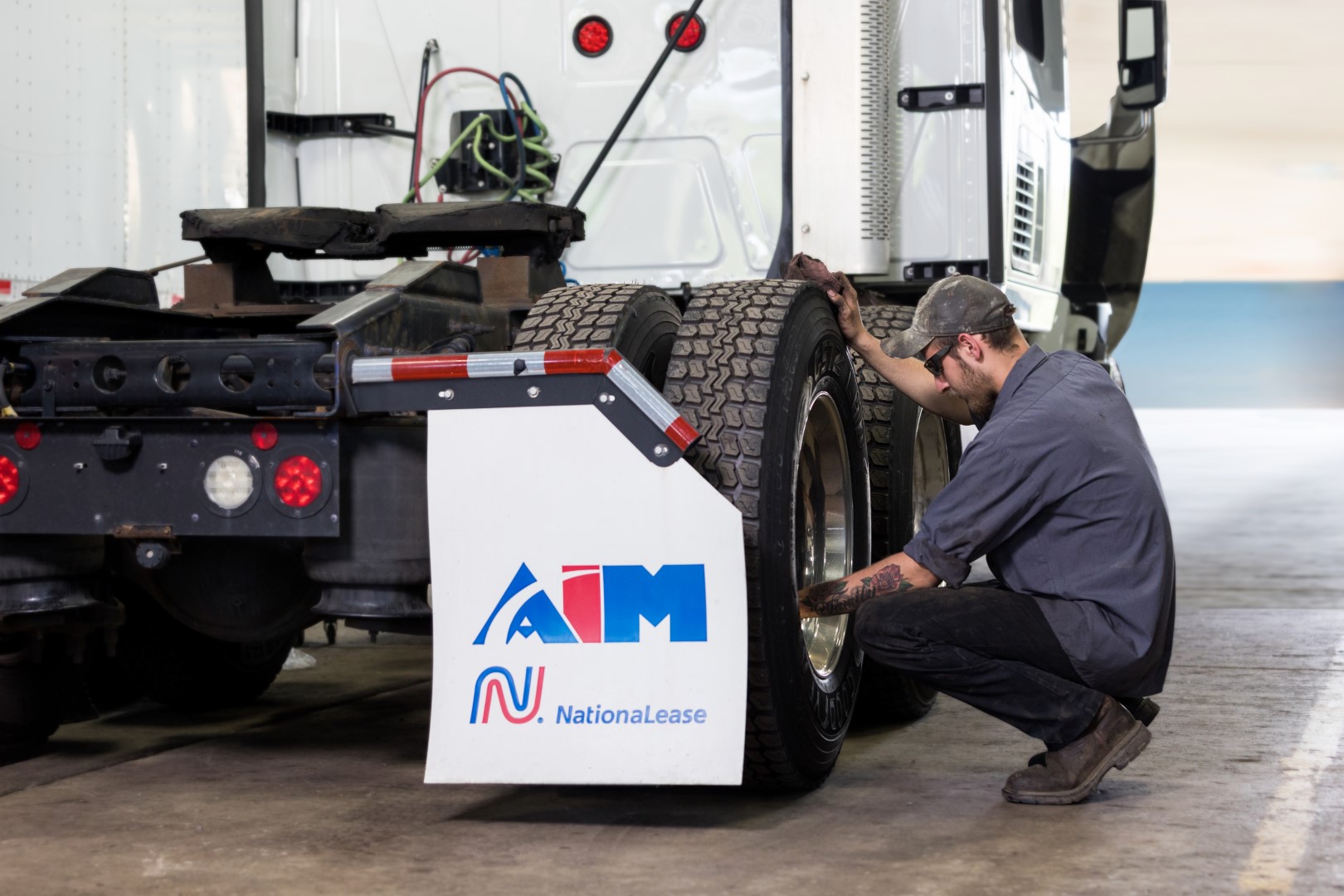 Aim Mechanic working on a wheel