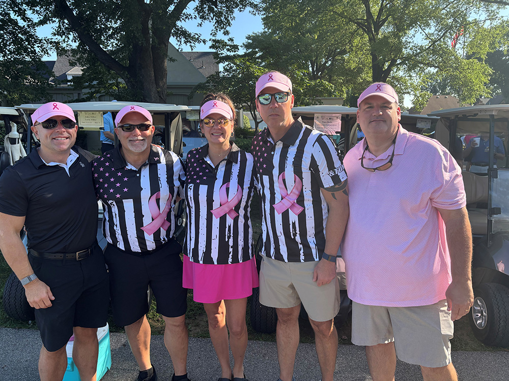 Representatives from Aim and Wincore pose for a team photo.