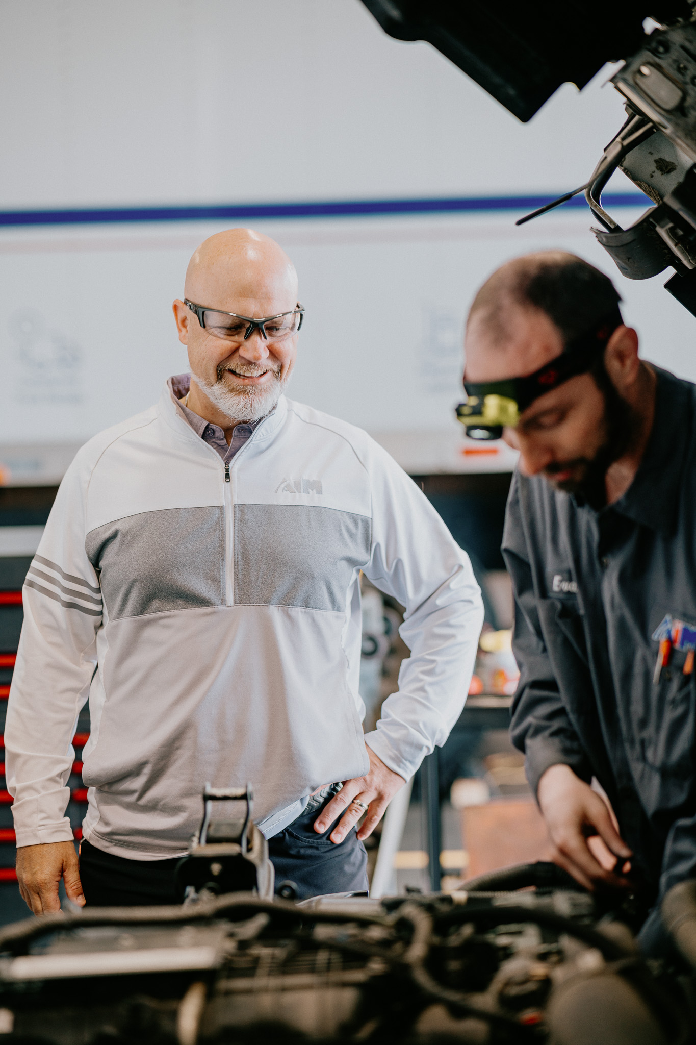 Aim President, Scott Fleming, visits with one of Aim’s highly skilled diesel technicians, highlighting his and the company’s commitment to caring for and supporting the hardworking employees who drive Aim’s success.