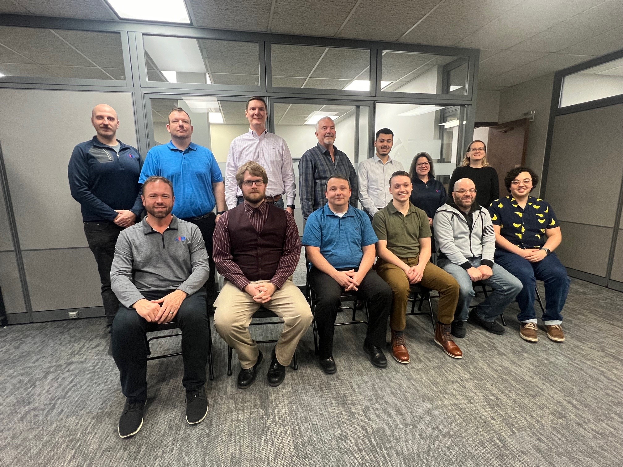 Aim's Software Development team poses for a group photo.